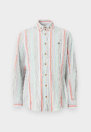 Košeľa na zapínanie na gombíky svetlomodrej, korálovej a čiernej farby s vertikálnymi pruhmi. Vrúbkovaná textúra, hnedé gombíky a pruhované manžety. Malý vyšívaný detail na hrudi.