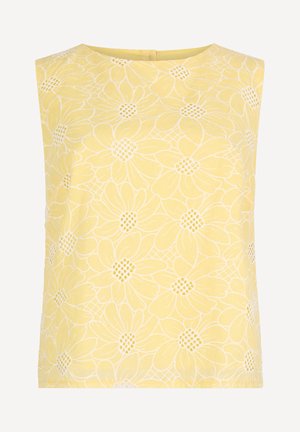 Sleeveless yellow blouse with white floral lace overlay and round neckline, featuring a subtle back zipper closure.