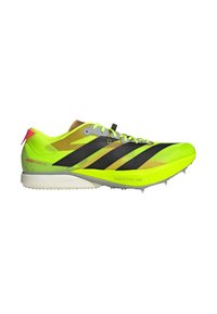 Chaussure d'athlétisme légère jaune néon et noire avec un design à lacets et une semelle "Lightstrike Pro" pour la performance en piste et terrain.