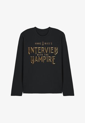 Black long-sleeve shirt with gold metallic text reading "Anne Rice's Interview with the Vampire" centered on the front.