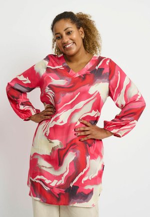Red and pink patterned tunic with a V-neck, long sleeves, and gathered cuffs. Made from lightweight fabric with abstract swirls.