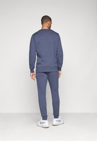 Björn Borg CENTRE TAPERED PANTS - Treniņtērpa apakšdaļas - odyssey gray