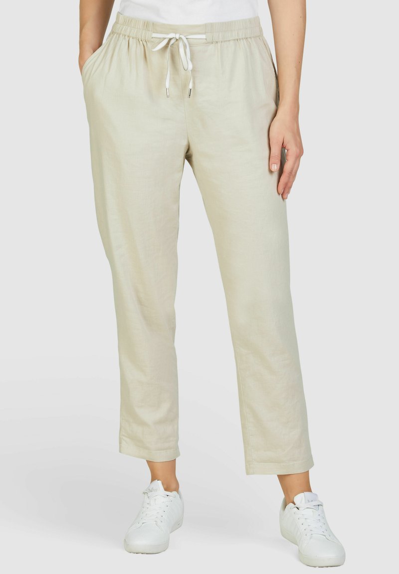 Beige linnen broek met een elastische tailleband en een trekkoordsluiting, voorzien van zijzakken en een rechte pijp.