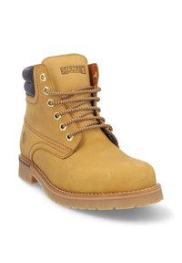 Bota de cuero marrón hasta el tobillo con puntera redondeada, superficie texturizada, ojales de metal y cordones marrones. Presenta un cuello acolchado para mayor comodidad.