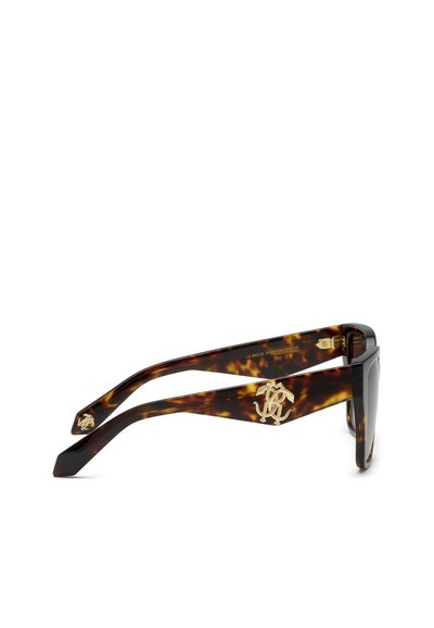 Monture de lunettes à motif écaille avec des branches larges et un logo décoratif doré sur le côté.