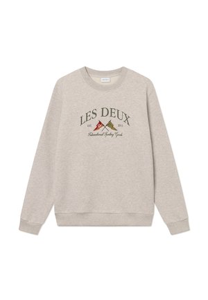 Beige sweatshirt med rundad halsringning, ribbade ärmslut och nederkant. Har broderad "LES DEUX" och färgglada flaggor, mjuk textur, avslappnad design.