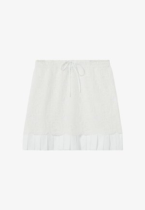 Mini-jupe en dentelle blanche avec cordon de serrage à l'avant et ourlet plissé, idéale pour une tenue décontractée ou estivale.