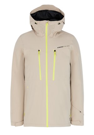 Hellbeige wasserdichte Jacke mit schwarzer Innenauskleidung, gelben Reißverschlüssen, zwei Brusttaschen und durchlöcherten Details an der Kapuze.