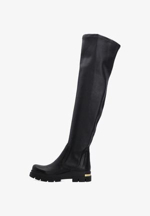 Zwarte leren over-de-knie laarzen met een chunky zool, elastische zijpanelen en een metallic accent op de hak. Gladde textuur, strak ontwerp.