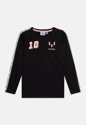 Svart langermet skjorte med rosa "10" og "MESSi" logoer, hvite skulderstriper med små svarte grafikker, og rund halsringning.