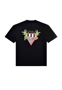 Musta puuvillapaita, jossa on värikäs graafinen kuvio selässä, mukaan lukien trooppisia lehtiä, ruutukuosi ja teksti "Pas de Monaco."