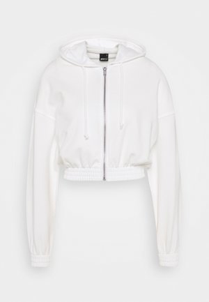 Tröja med dragkedja - white