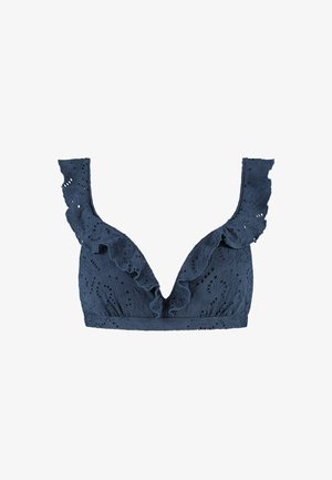 Bralette en dentelle bleu marine avec un décolleté plongeant en V, des volants le long des épaules et des motifs découpés complexes partout.