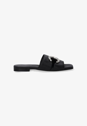 Black leather slide sandal featuring a wide strap and a silver metallic accent on the front. Flat sole, smooth texture, minimalistic design.