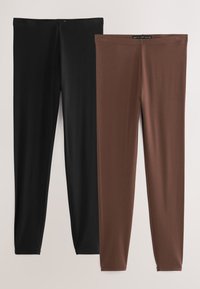 Kaks paari venivaid retuuse: üks must ja üks pruun. Mõlemad on ühtlase tekstuuriga ja keha järgiva lõikega, kitsenevad pahkluude juures.