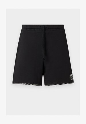 Short noir à cordon avec taille élastique, ourlet blanc cousu et petit logo floral blanc sur la partie inférieure de la jambe droite.