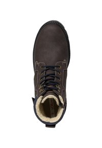 Bottine en cuir marron avec des lacets foncés et des œillets dorés. Dotée d'une douce doublure en fourrure beige et d'une semelle extérieure noire robuste.