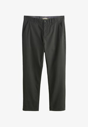 Tumed rohelised puuvillased püksid lameda eest, külgmiste taskutega ja nupuga kinnitusega. Sile tekstuur, sirge jala disain, nähtavaid mustreid ei ole.