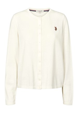 Vit kofta gjord av mjukt stickat tyg. Har en rund halsringning, knappar fram och en broderad logotyp på vänster bröst. Långa ärmar.