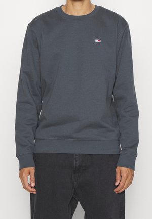 Grijze sweatshirt met ribgebreide manchetten en zoom. Bevat een klein logo op de borst, ontwerp met ronde hals en zachte stoftextuur. Casual pasvorm.