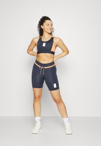 Puma RUN FIRST MILE BIKER - Leggings - parisian night