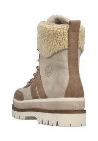 Jasnobrązowe zamszowe botki z kremowym futerkiem syntetycznym na górze. Posiadają metalowe oczka i sznurowanie. Gruba biała podeszwa z teksturowanym wzorem zapewniającym przyczepność.