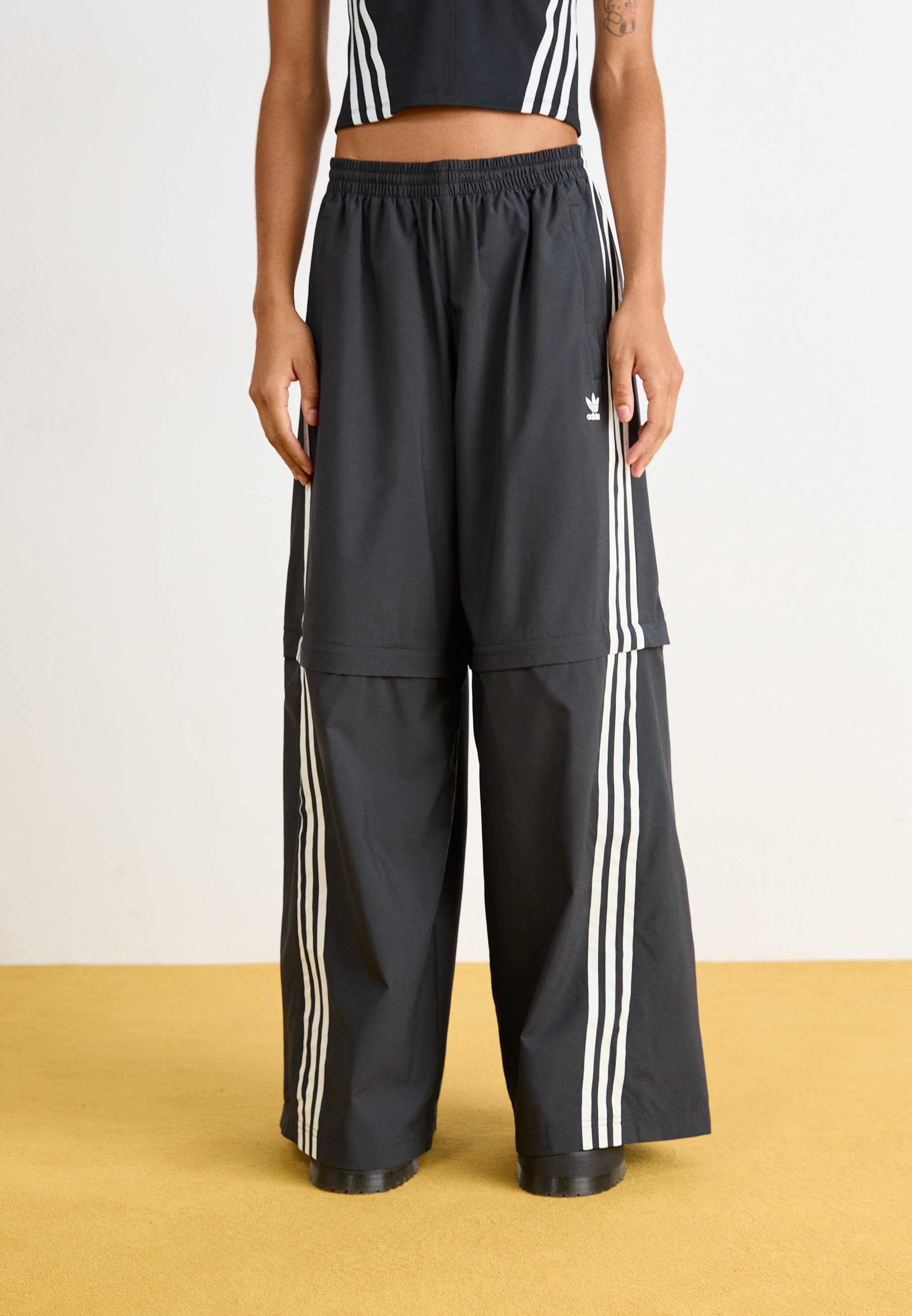 adidas tracksuit bottoms with zip legs