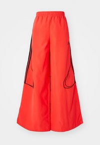 TEAMGEIST - Pantalon de survêtement - lucid red/black