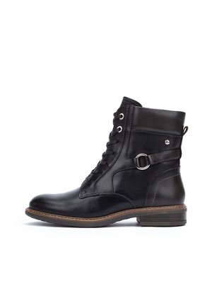 Black leather ankle boot featuring a lace-up front, side buckle detail, and a low stacked heel. Smooth texture with a rounded toe design.
