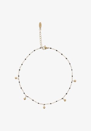Guld kæde ankel kæde med sorte perler, der har tre små guldklokker. Sammenkoblet design med justerbar lås og forlængerkæde.