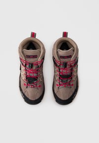 Pair of beige and black hiking shoes with red laces and CMP logo, viewed from above on a white background.