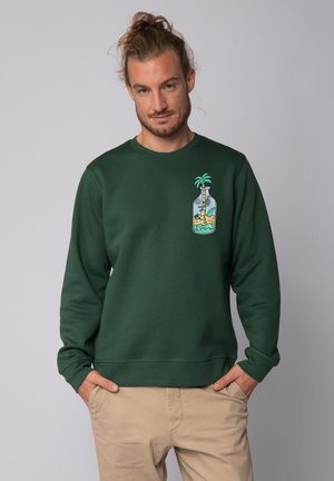 Groene sweatshirt van katoen met een grafisch ontwerp van een palmboom in een fles. Geribde kraag en manchetten, comfortabele pasvorm.