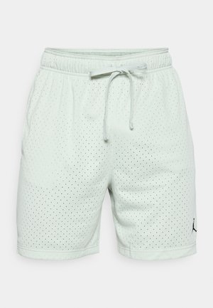 Light green athletic shorts with perforated texture, elastic waistband, drawstring, and black logo on the lower left side.