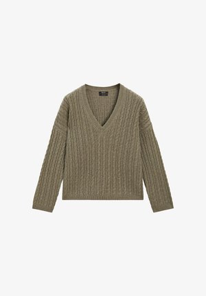 Olivgrön V-ringad tröja med ribbad textur och kabelstickad design. Har långa ärmar och en kortad längd.