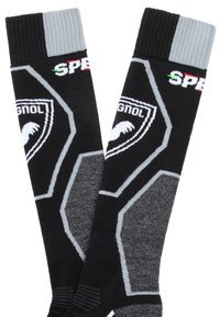 Calcetines negros con un patrón hexagonal, acentos grises y un logotipo. Presenta puños acanalados y un tejido texturizado para mayor durabilidad y comodidad.