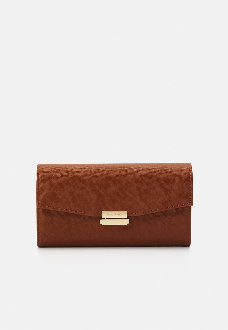 Brown textured faux leather wallet with a gold-tone clasp and visible brand nameplate, featuring a flap closure and rectangular shape.