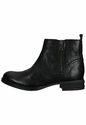 Bottine noire en cuir avec un bout rond, une fermeture éclair sur le côté et des détails cousus. Elle possède un petit talon empilé et une texture lisse.
