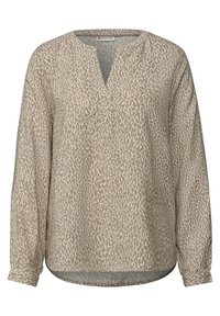 Blouse beige à manches longues avec un col en V, présentant un motif léopard subtil dans des tons beige plus foncés. Confectionnée dans un tissu léger.