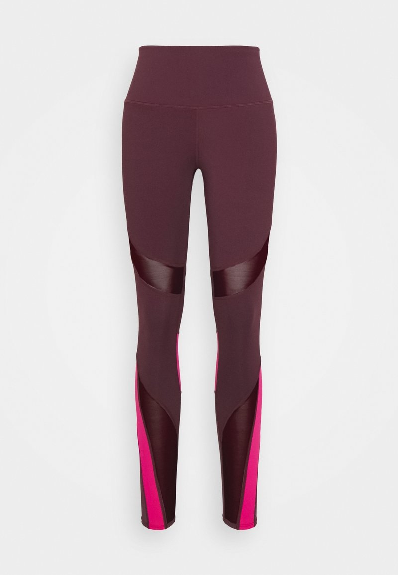 Höga träningsleggings i mörk burgundy med glänsande paneler och ljusrosa detaljer längs med underbenen.
