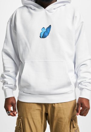 White hooded sweatshirt with a blue butterfly graphic on the chest, featuring a front pocket and ribbed cuffs and hem.