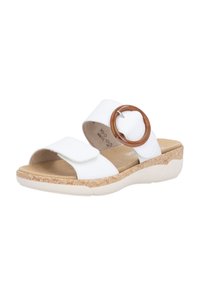 White slide sandals with a round brown accent and double straps. Textured tan footbed and patterned cork-like sole provide contrast.