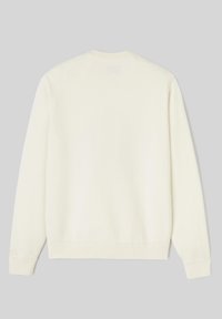 Sweatshirt de couleur crème avec col rond, manches longues, poignets et ourlet côtelés. Présente une discrète étiquette de marque à l'arrière.
