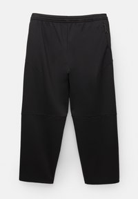 Schwarze Sporthosen mit lockerer Passform, elastischem Bund, Seitentaschen und kontrastierenden Paneelakzenten für zusätzliche Details. Weiche Textur.