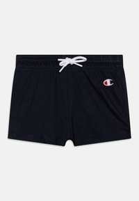 Navy blue cotton swim shorts with an elastic waistband, white drawstring, and logo patch on the left side. Smooth texture and solid color.