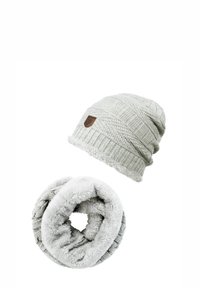 Knitted beanie and faux fur snood in light gray. Beanie features a textured pattern and a brown leather logo badge. Soft, cozy finish.