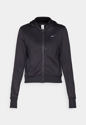 Black zip-up hoodie made of smooth fabric, featuring a drawstring hood and a small blue Nike logo on the chest. Cropped design with ribbed cuffs.