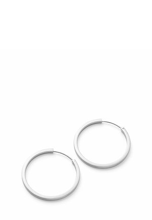 Pair of smooth silver hoop earrings with thin wire clasps on a white background.
