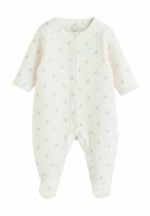 Witte babyromper gemaakt van zachte stof met een geribbelde textuur en kleine blauwe dierenpatronen. Voorzien van lange mouwen en drukknopen.