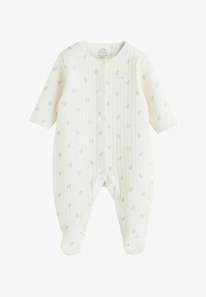 Pelele blanco para bebé hecho de tela suave con textura acanalada y pequeños patrones de animales en azul. Cuenta con mangas largas y cierres a presión.