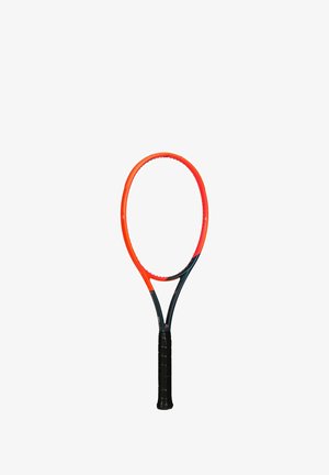 Tennis racket with an orange and black frame, oval shape, and a textured black handle. The strings are absent, highlighting the frame design.